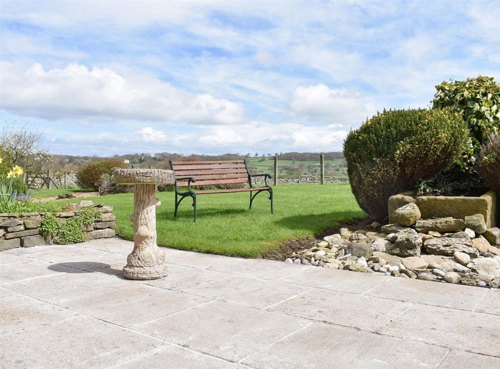 Paved patio area leading to garden at Paddock House in Middleham, near Leyburn, North Yorkshire