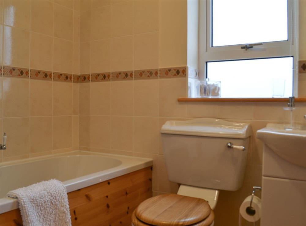 Bathroom with shower over bath at Padraigs Cottage in Howbeg (Tobha Beag), Isle of South Uist, Scotland