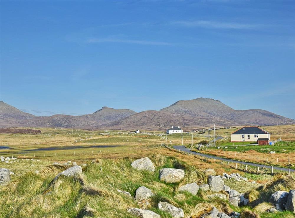 Sitting in the shadow of the formidable Hebridean hills at Padraigs Cottage in Howbeg (Tobha Beag), Isle of South Uist, Scotland