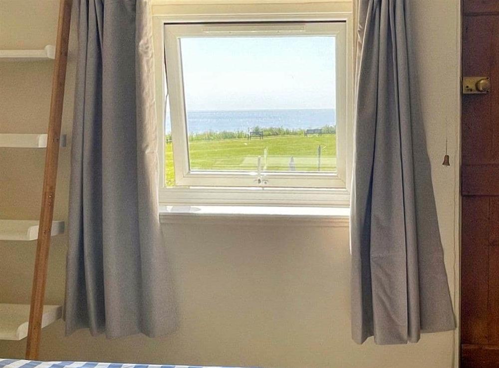 Bedroom with sea views at Pakefield Cottage in Lowestoft, Suffolk