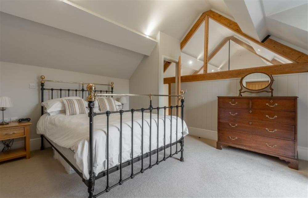 First floor: Master bedroom with king-size bd at Palgrave Barn, Burnham Market near Kings Lynn
