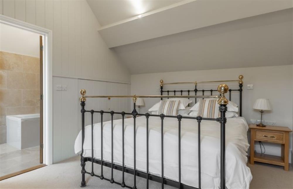 First floor: The master bedroom has en-suite bathroom at Palgrave Barn, Burnham Market near Kings Lynn