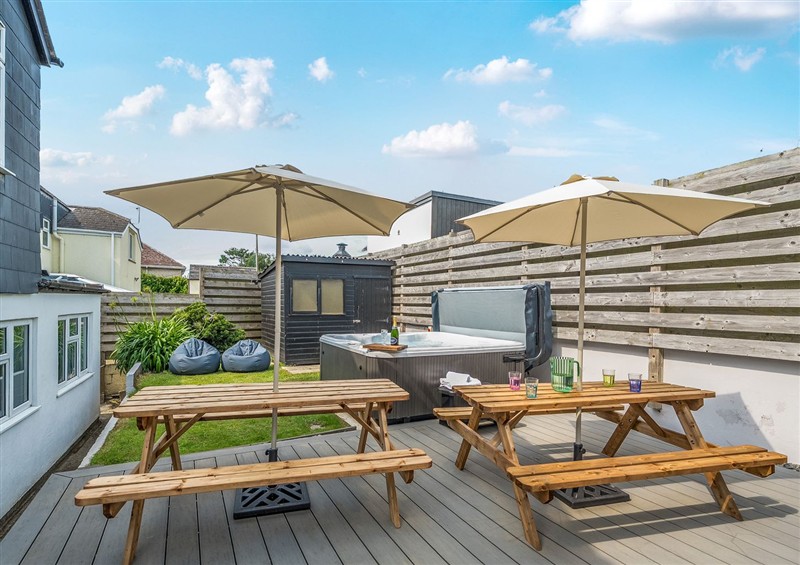 Enjoy a glass of wine on the patio at Palm House, Newquay