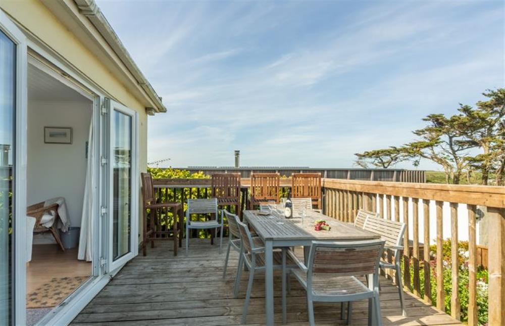 Palm Trees, Polzeath. Spacious wooden balcony, with inbuilt bar seating and gas barbecue at Palm Trees, Polzeath