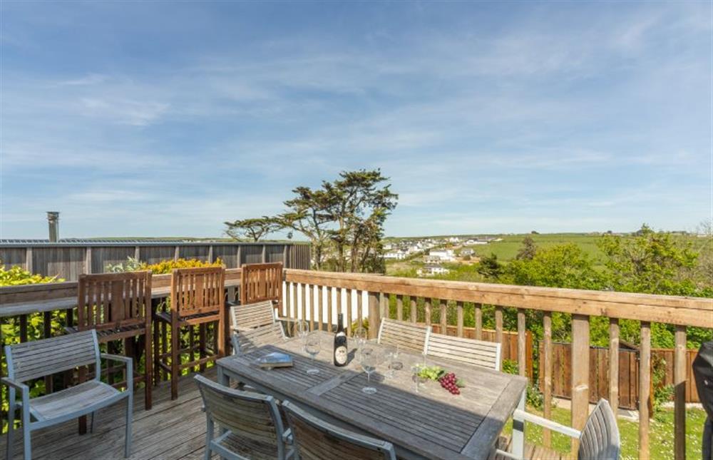 Spacious wooden balcony, with lovely views, inbuilt bar seating and gas barbecue at Palm Trees, Polzeath