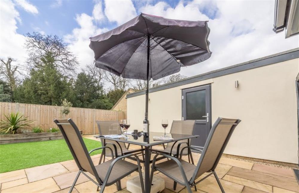 Palmstone: The fully enclosed garden with seating for up to four people  at Palmstone, Heacham near Kings Lynn
