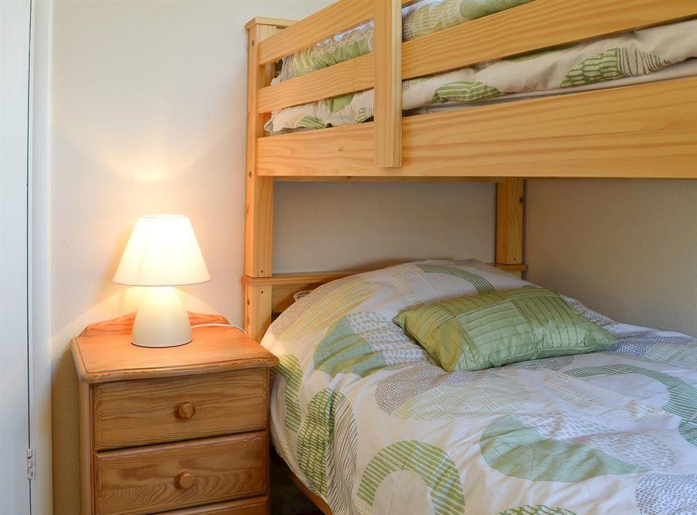 Bedroom with traditional wooden bunk beds at Pams Plaice in Offord D’Arcy, near Godmanchester, Cambridgeshire, England