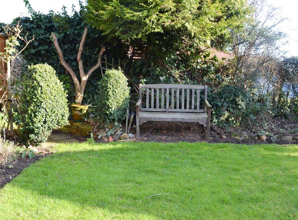 Garden with secluded bench at Pams Plaice in Offord D’Arcy, near Godmanchester, Cambridgeshire, England