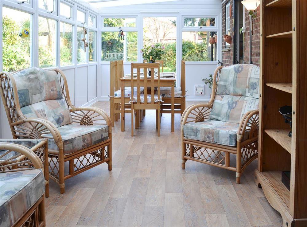 Sunny conservatory with dining table