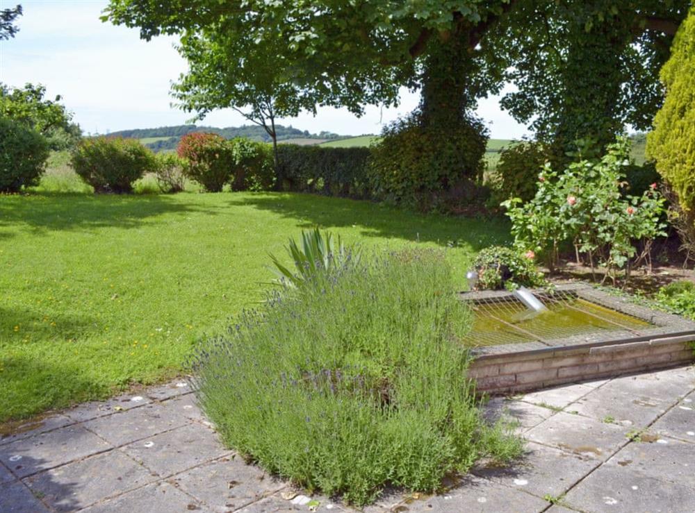 Enclosed lawned garden with patio (photo 2) at Pant Glas Mawr Cottage in Axton, near Holywell, Clwyd