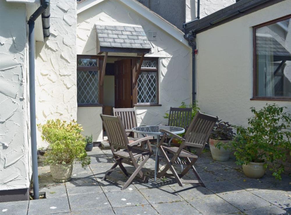 Enclosed lawned garden with patio at Pant Glas Mawr Cottage in Axton, near Holywell, Clwyd