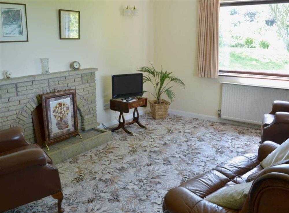 Homely living room at Pant Glas Mawr Cottage in Axton, near Holywell, Clwyd