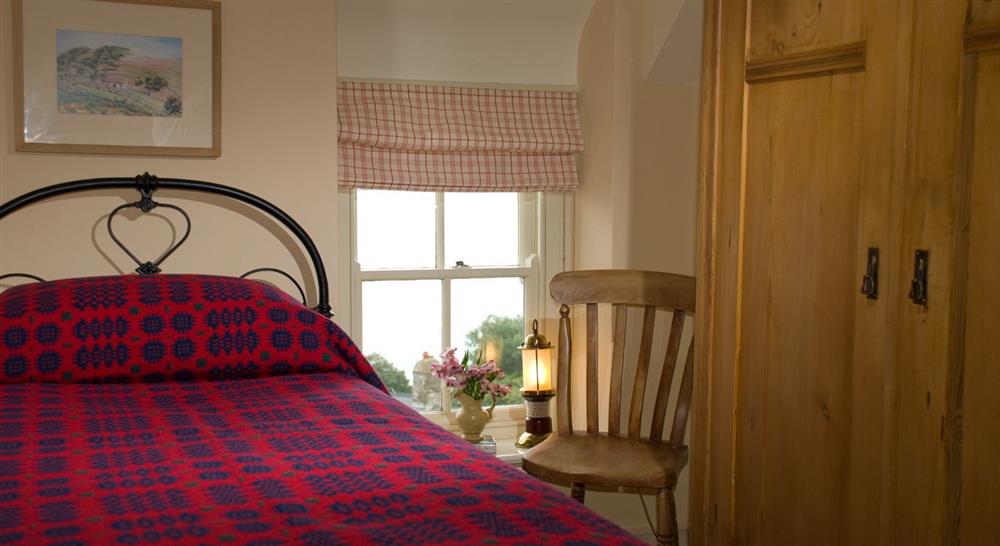 Twin bedroom at Pant Rhiw Cottage in Pwllheli, Gwynedd