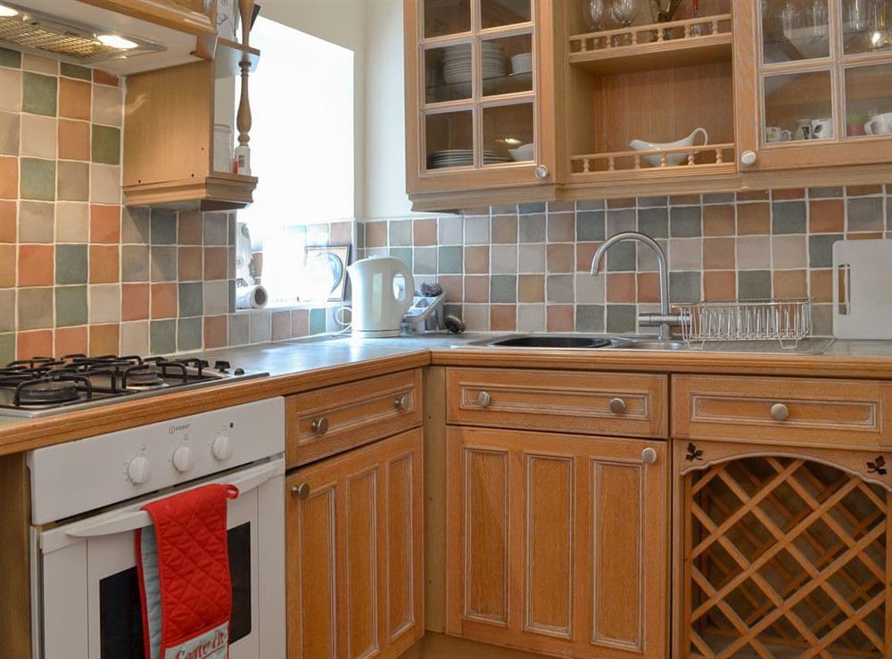 Well equipped kitchen area at Pant Y Mel in Llanbedrgoch, near Benllech, Anglesey, Gwynedd