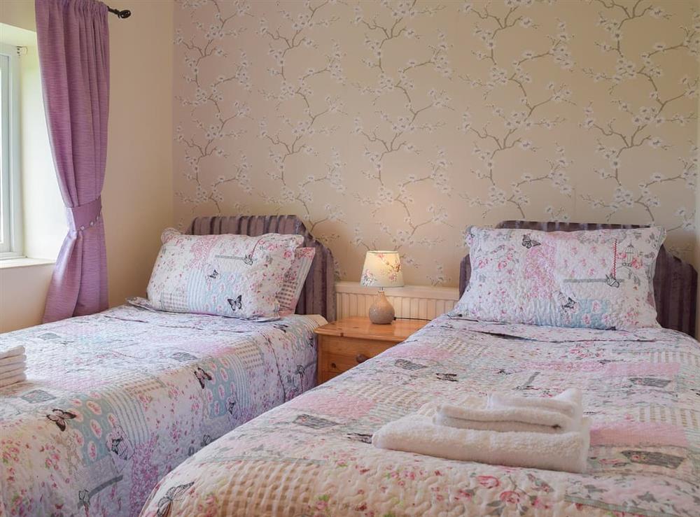 Attractive twin bedded room at Lower Mill Barn, 
