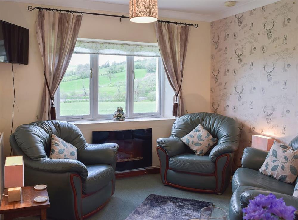 Cosy and inviting living space at Lower Mill Barn, 