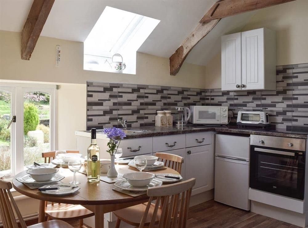 Kitchen with dining area at Upper Mill Barn, 