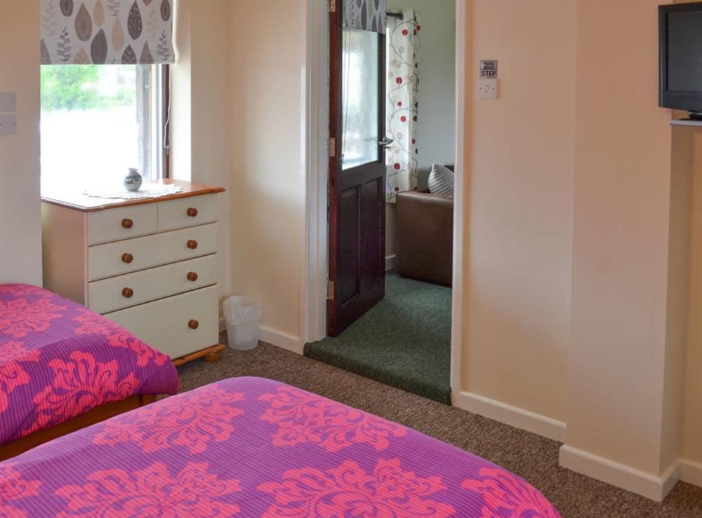 Twin bedroom with en-suite wet room and wc at Manacle View, 
