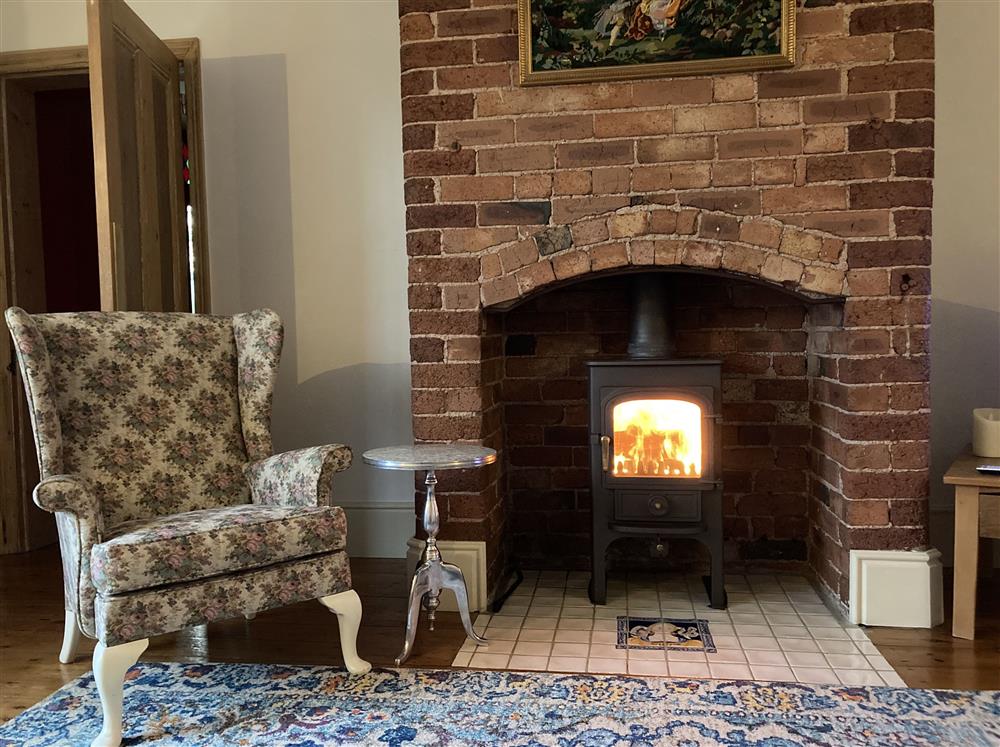 Relax in front of the wood burning stove at Park Corner, Sutton Scarsdale