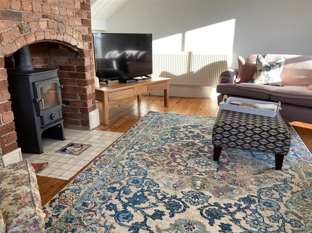 The cosy sitting area, with a wood burning stove