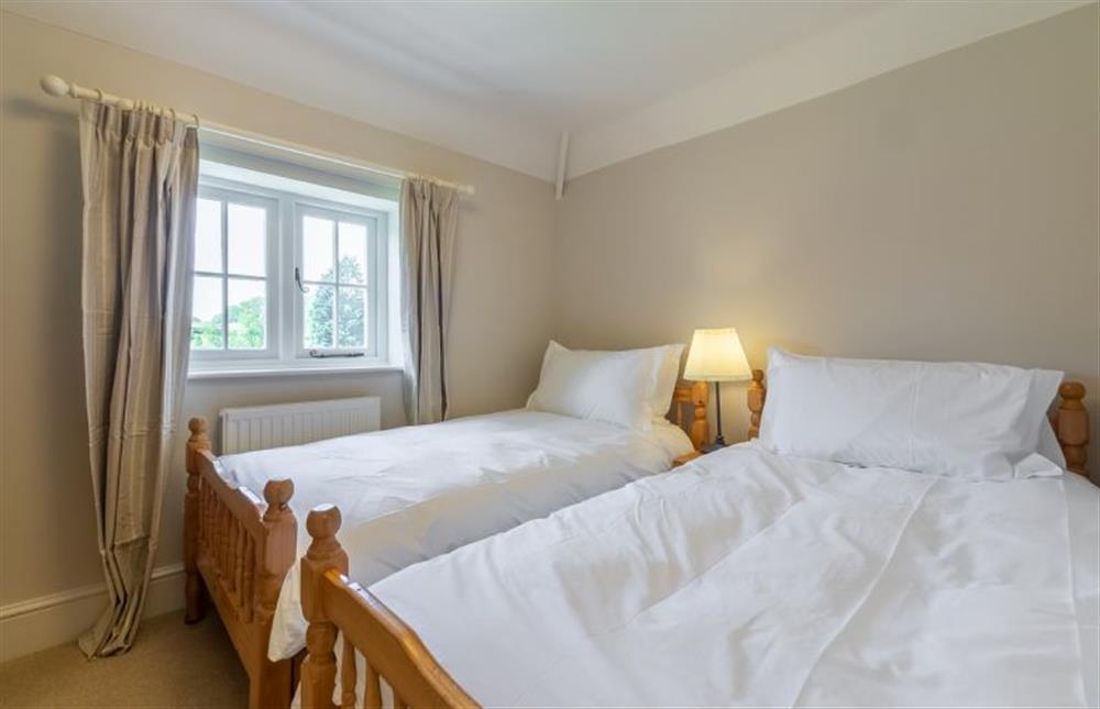 First floor: Bedroom three with full size twin beds at Park Cottage, Fring near Kings Lynn