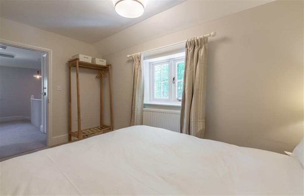 First floor: Bedroom two with hanging rail at Park Cottage, Fring near Kings Lynn