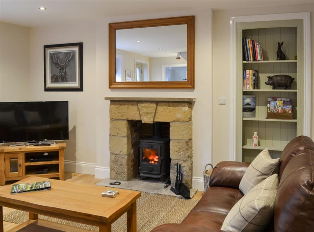 Cosy living room with dining area at Park Farm Cottage in Flixton, near Filey, North Yorkshire