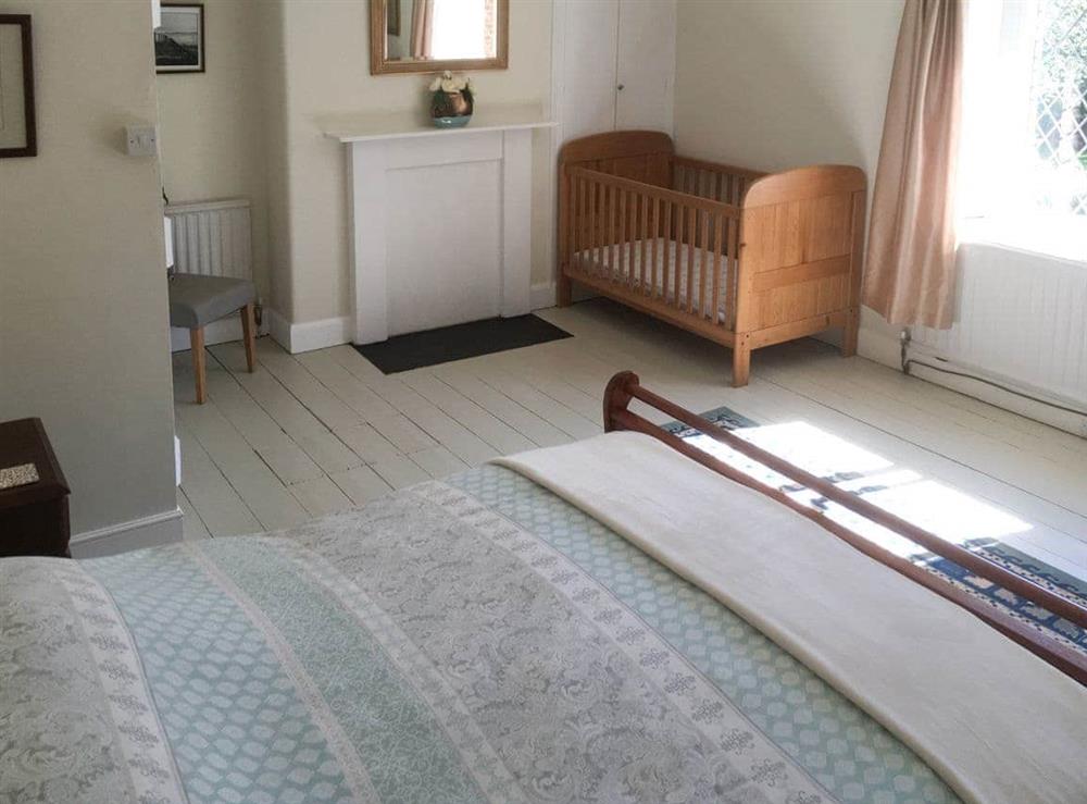 Large double bedroom with full-size cot (photo 3) at Park House in Harlaxton, near Grantham, Lincolnshire