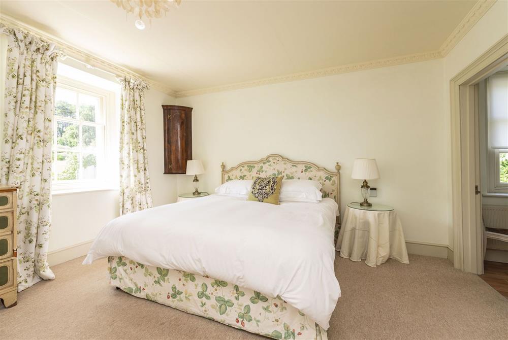 First floor bedroom one with 6’ super-king size bed and en-suite bathroom at Park House, Winterborne Came