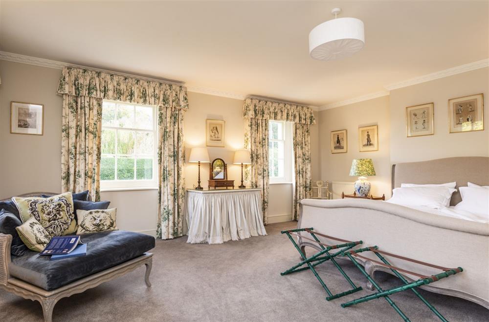 First floor bedroom one with 6’ super-king size bed and en-suite shower room at Park House, Winterborne Came