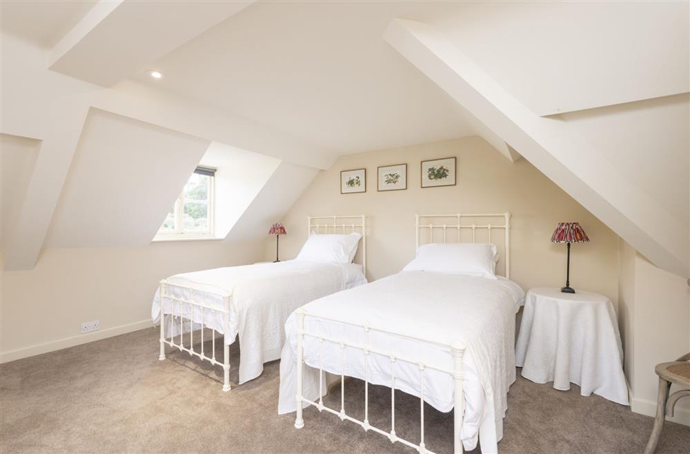 Second floor bedroom four with two 3’ single beds and a day bed at Park House, Winterborne Came