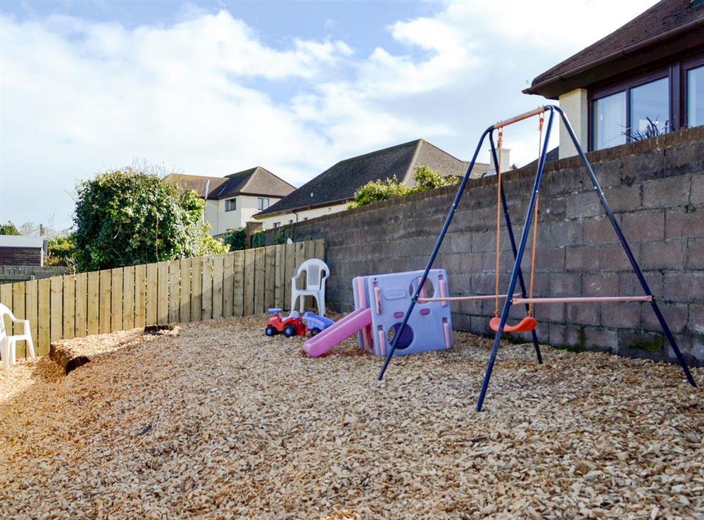 Children’s play area in the garden at Park View Cottage in Stranraer, Dumfries and Galloway, Wigtownshire