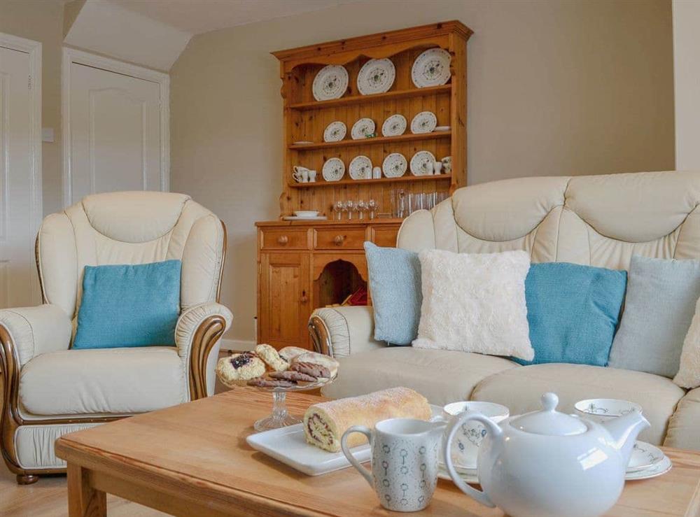 Charming living/ dining room (photo 2) at Parkside Cottage in Cleator Moor, Cumbria