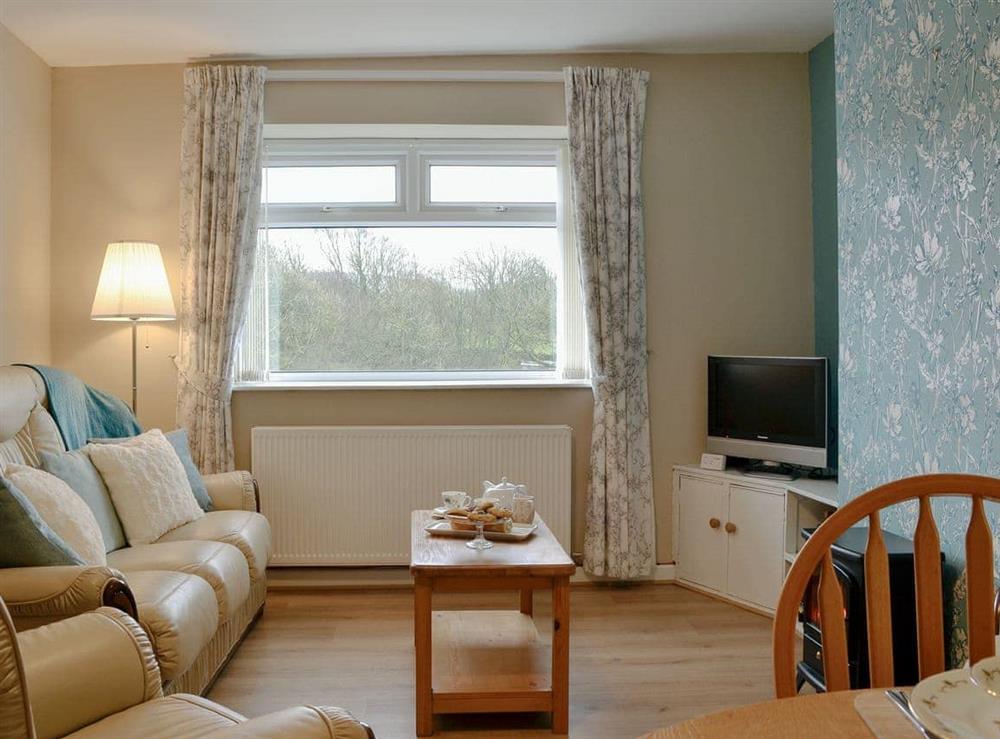 Comfortable living/ dining room at Parkside Cottage in Cleator Moor, Cumbria