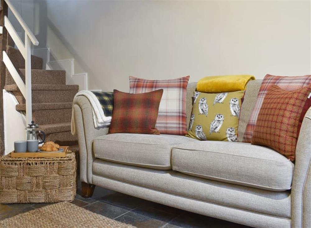 Comfy furniture and stairs to first floor at Parky Mews in Richmond, Yorkshire, North Yorkshire