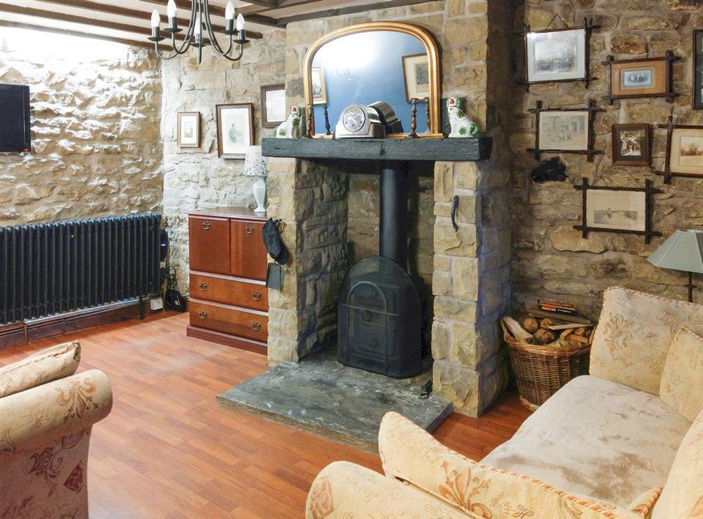 Cosy living room with a wood burner at Pathways in Higham, near Alfreton, Derbyshire