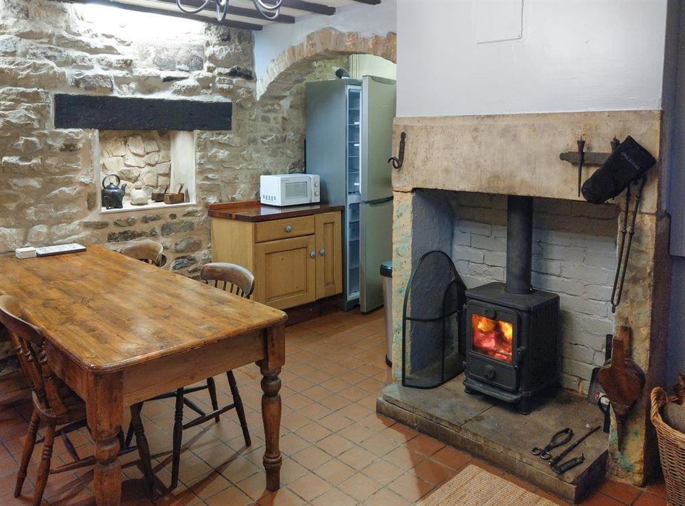 Warming wood burner within the kitchen/dining room at Pathways in Higham, near Alfreton, Derbyshire