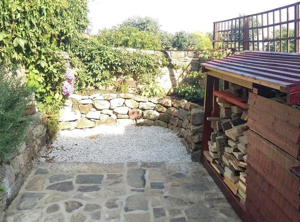 Wood-store within the rear courtyard at Pathways in Higham, near Alfreton, Derbyshire