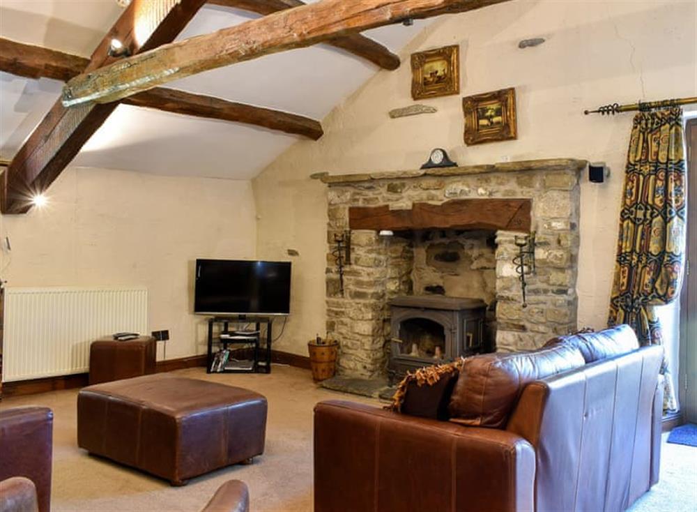 Cosy living area with open fire at Patton Mill in Patton, near Kendal, Cumbria