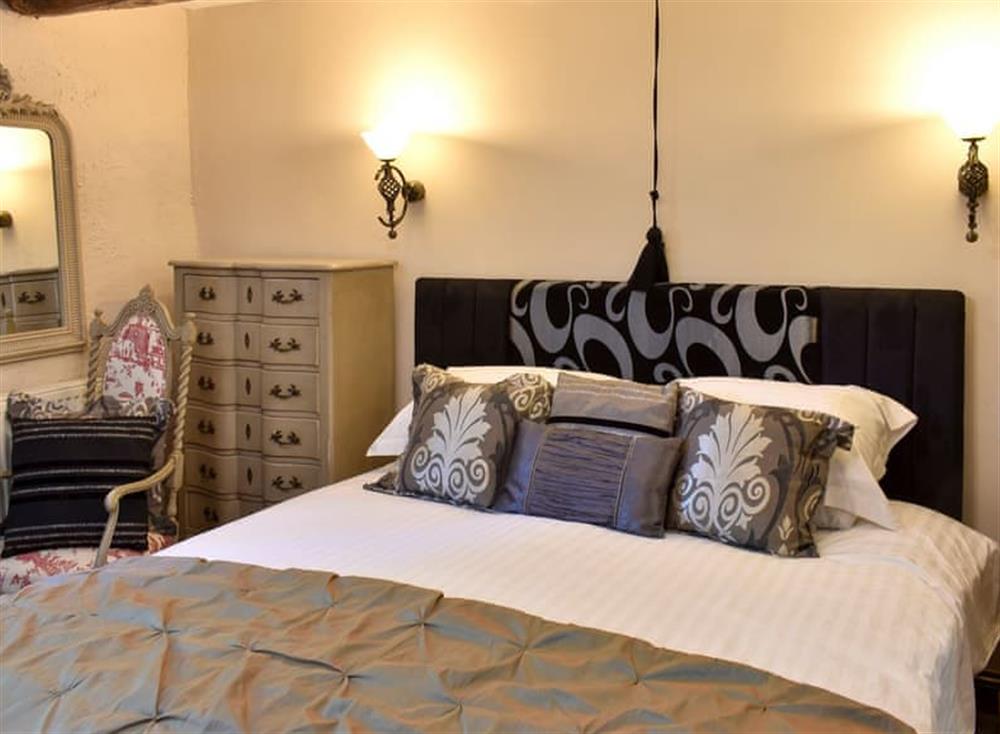 Relaxing bedroom with super kingsize bed at Patton Mill in Patton, near Kendal, Cumbria