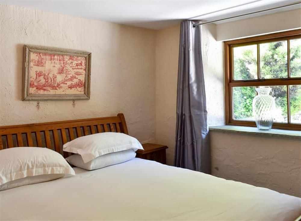 Tranquil bedroom with super kingsize bed at Patton Mill in Patton, near Kendal, Cumbria