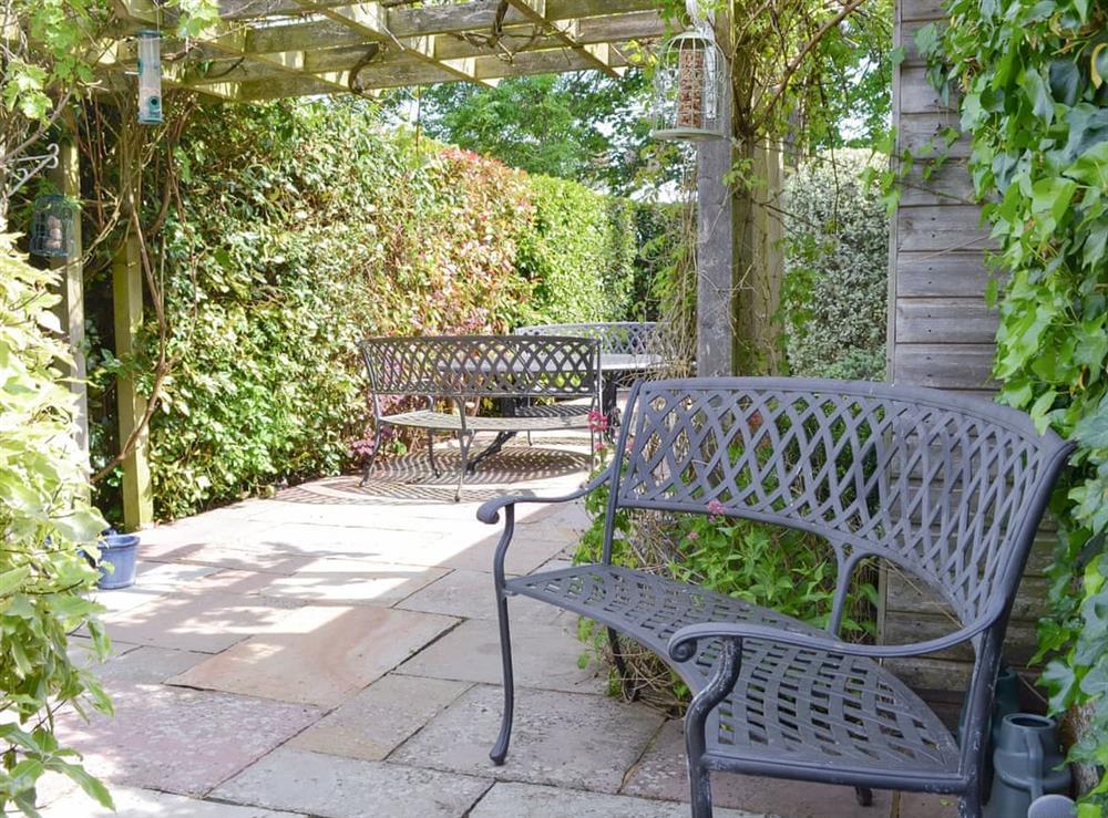 Well-maintained mature garden and patios at Pax in St. Margarets at Cliffe, near Dover, Kent, England