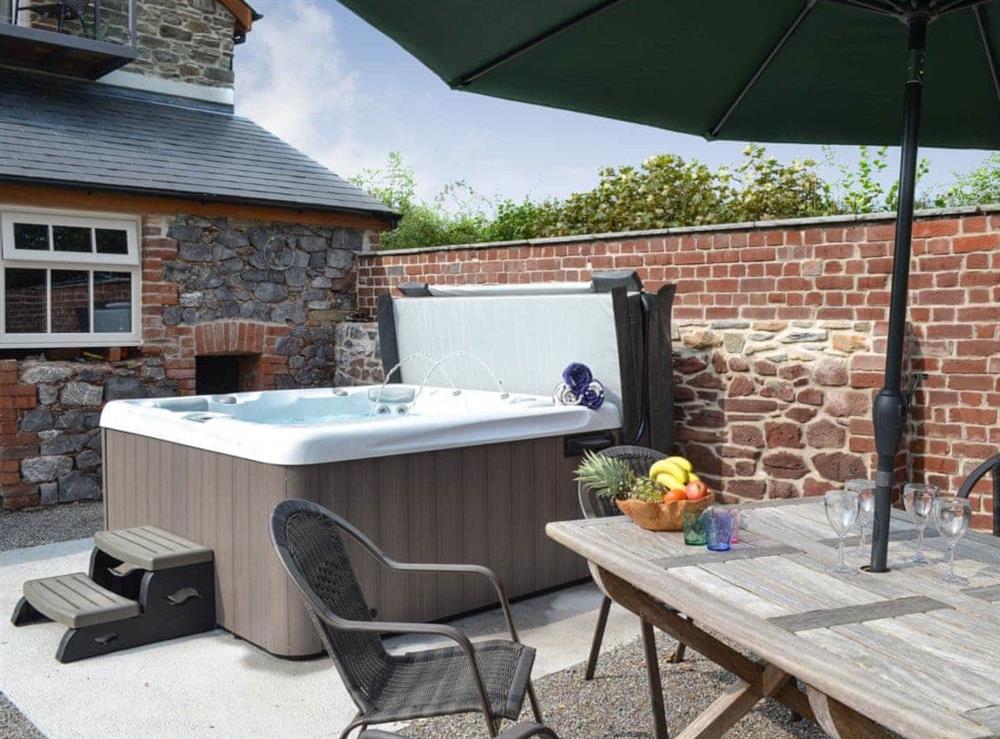 Hot Tub & outdoor dining area at Paxton View Barn in Llanddarog, near Carmarthen, Dyfed