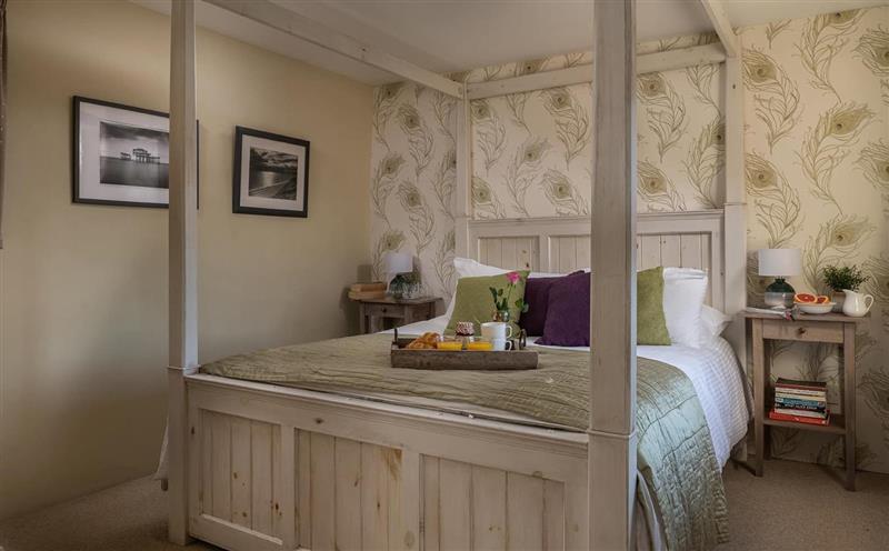 A bedroom in Peacock Cottage at Peacock Cottage, Combe Martin