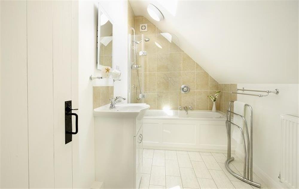 First floor: Family bathroom with shower over the bath and wc at Peak Hill Cottage, Theberton