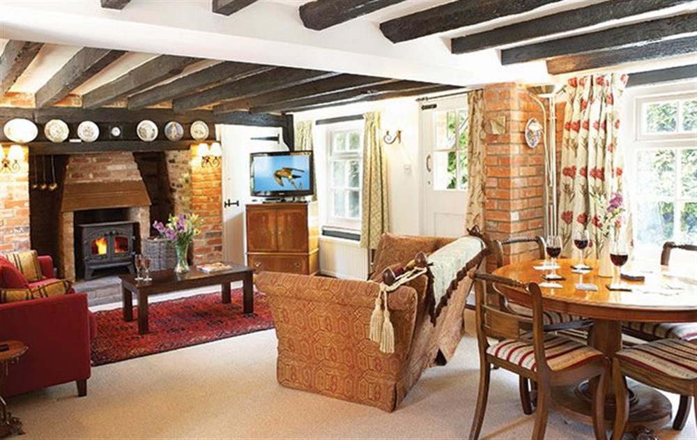 Ground floor: Sitting room with wood burning stove at Peak Hill Cottage, Theberton