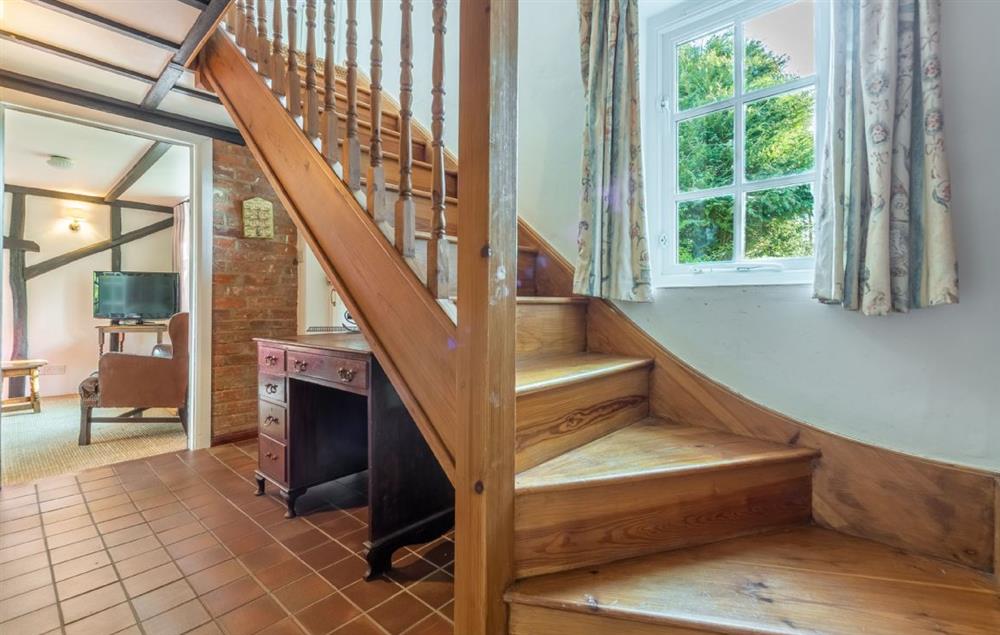 Hallway with stairs to the first floor at Peak Hill Cottage, Theberton