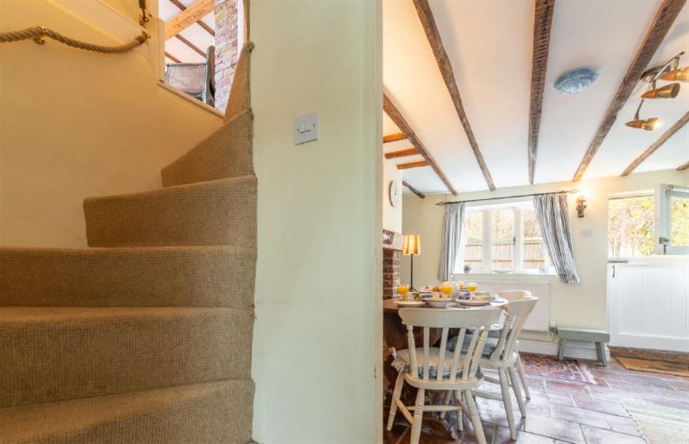 Traditional Norfolk winder stairs to first floor at Pear Tree Cottage, Blakeney near Holt