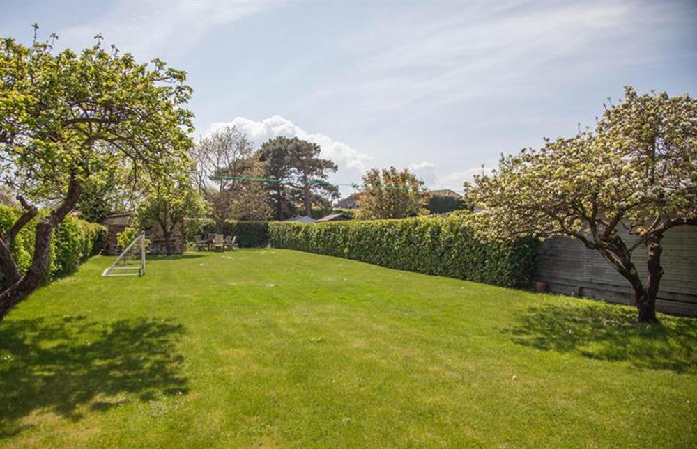 Large garden with fruit trees and lawn at Pear Tree Cottage, Holme-next-the-Sea near Hunstanton