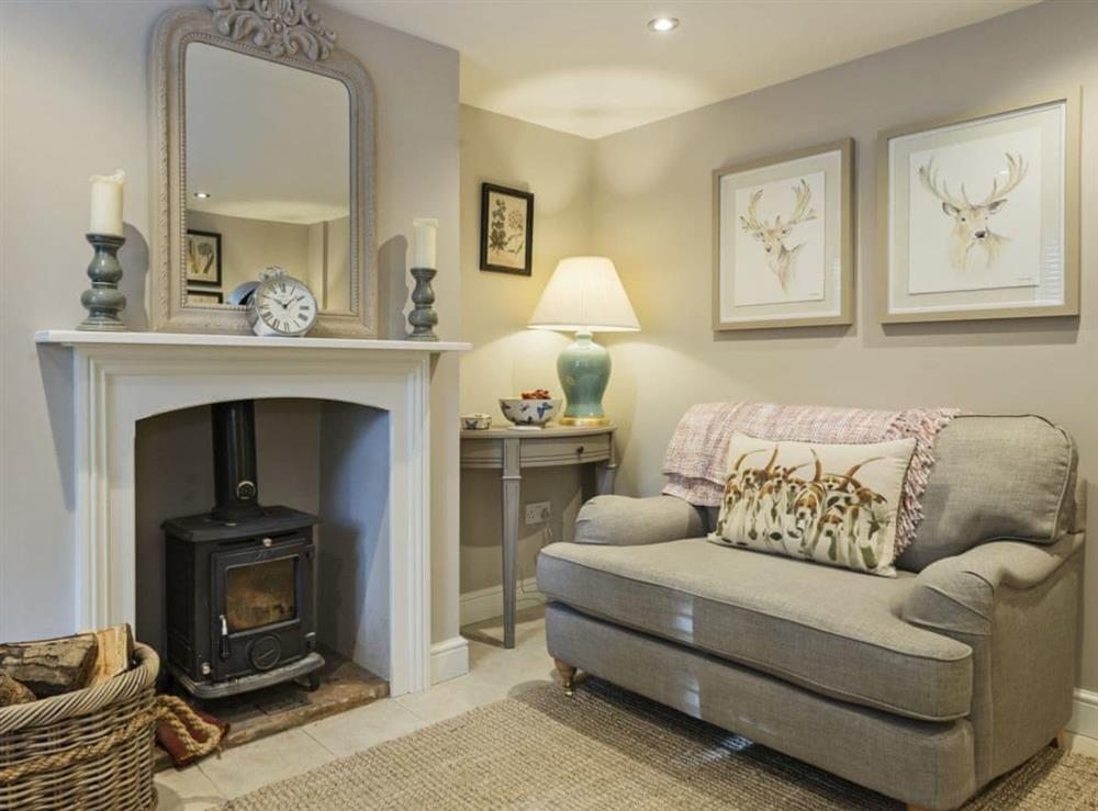 Stylishly furnished living room with wood burner at Pear Tree Cottage in Louth, Lincolnshire, England